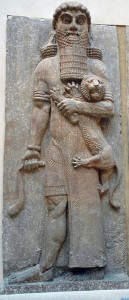 stone carving of Gilgamesh and a baby lion in his arm