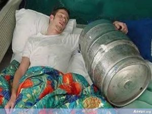 Dude sleeping with beer keg